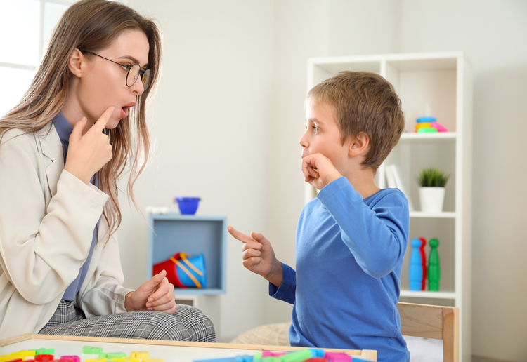 Speech therapist guiding a child through stuttering therapy at Jewel Autism Centre, promoting fluent speech, confidence, and effective communication skills.